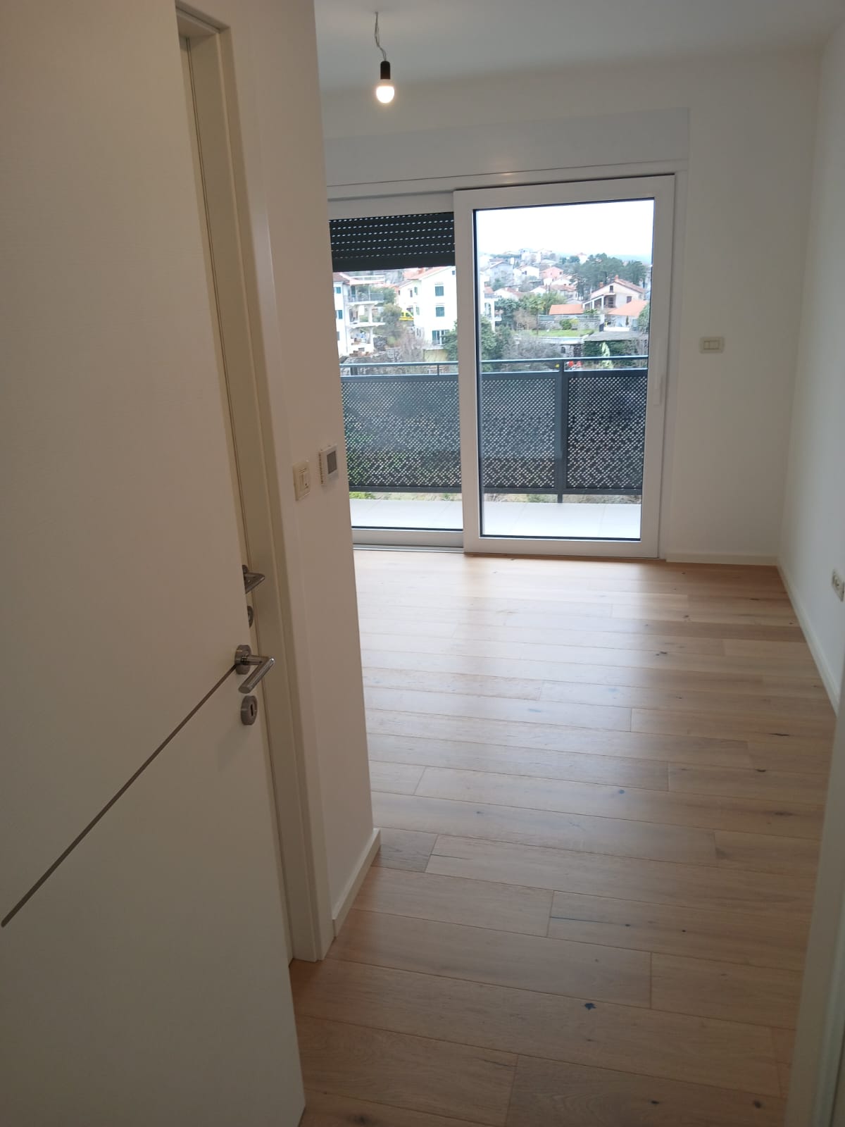 Bedroom with balcony view