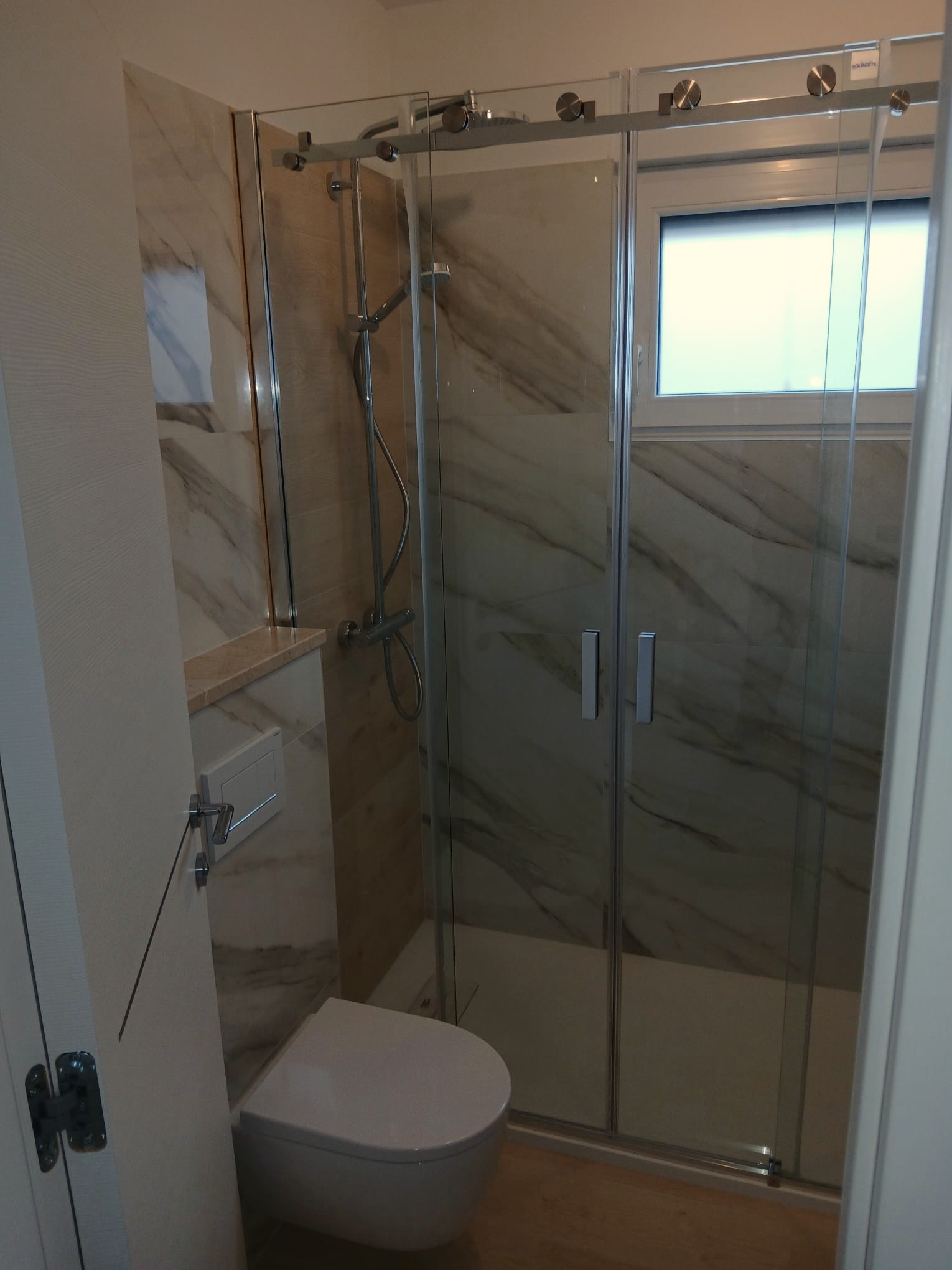 Bathroom with glass shower enclosure