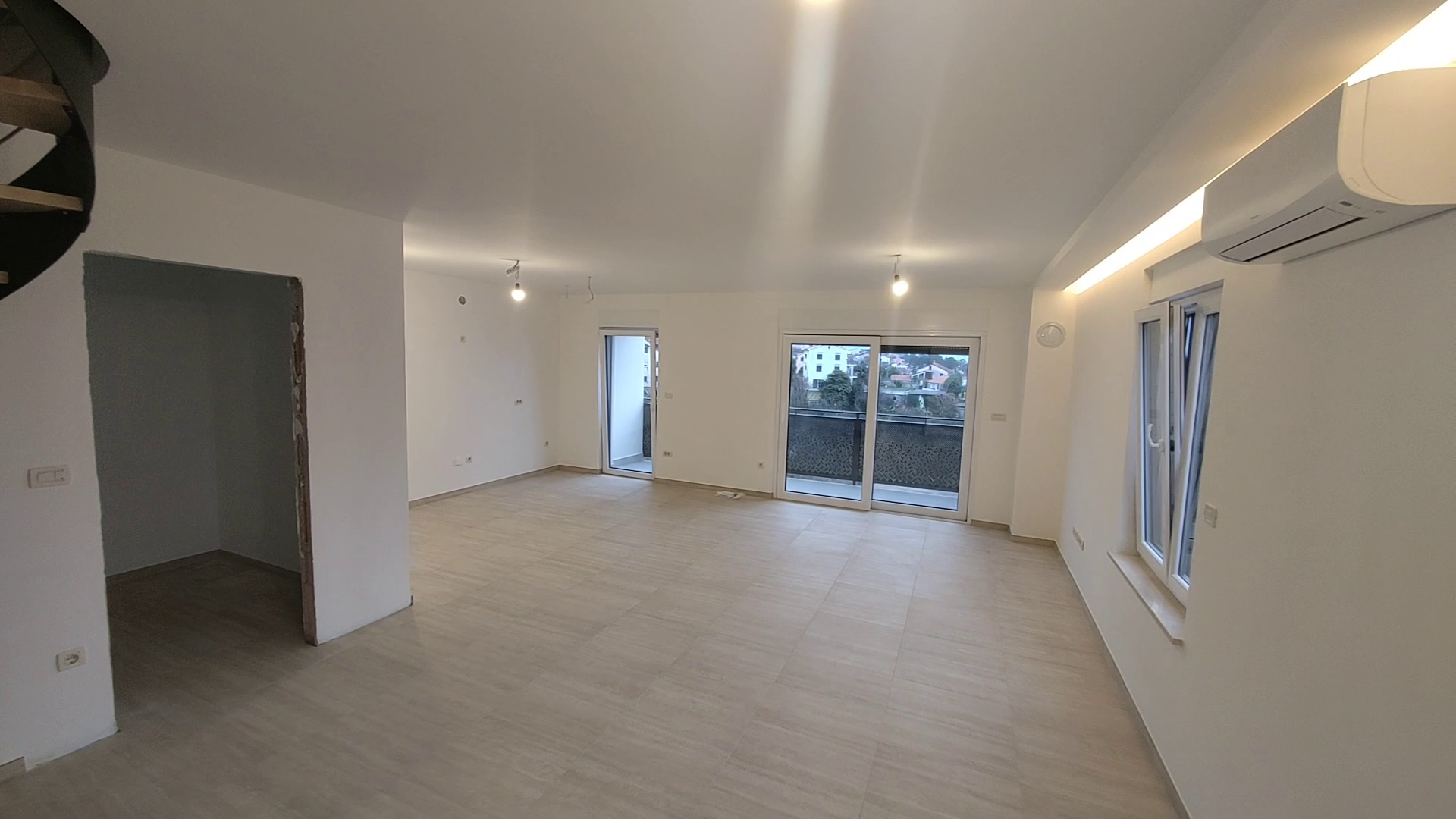 Spacious living room with balcony access