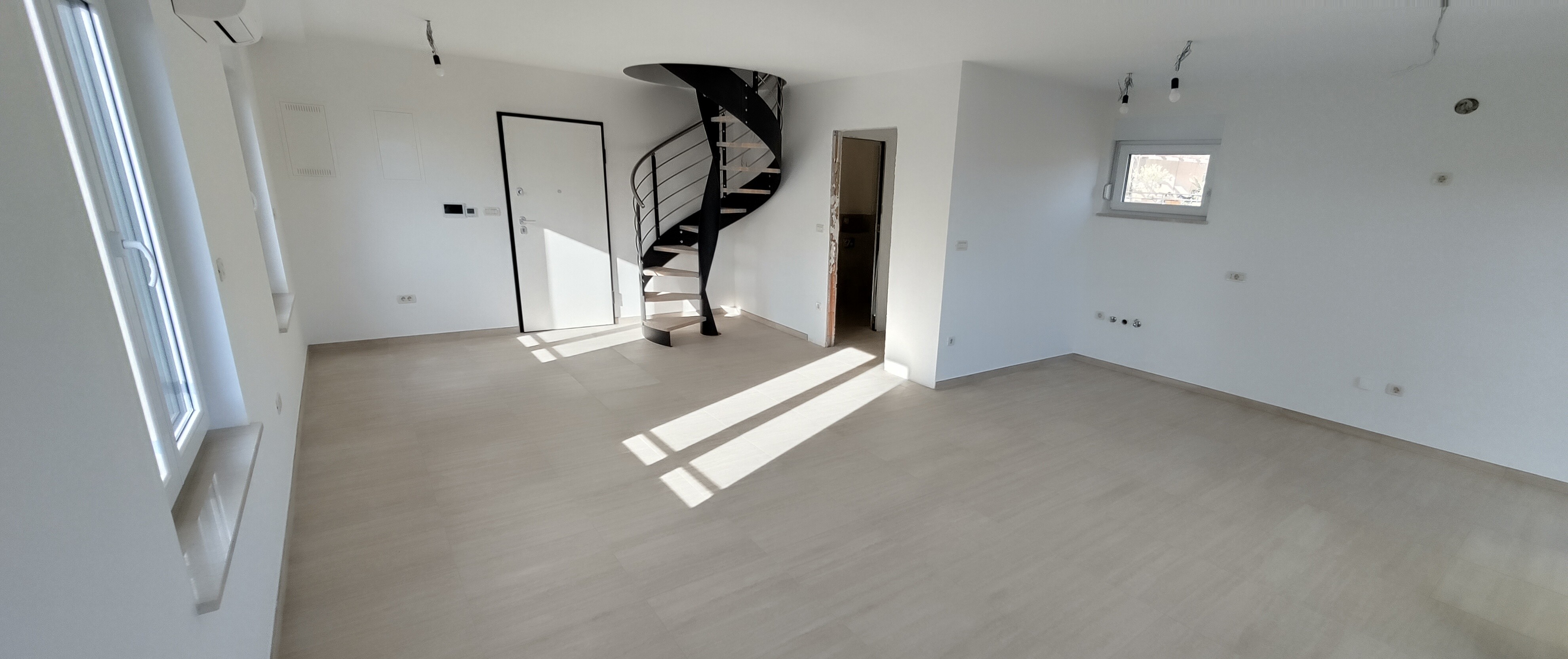 Living room with spiral staircase